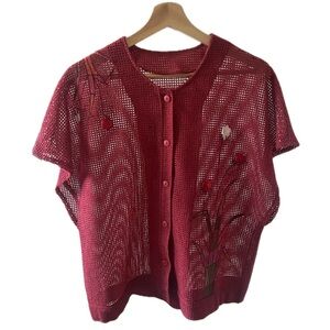 Stylish-red mesh, button up top. Intricate floral and beaded embellishments.